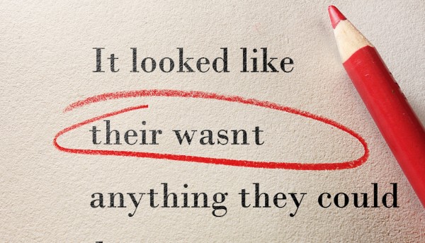 a book, with the word 'their' circled in red as it is incorrect grammar