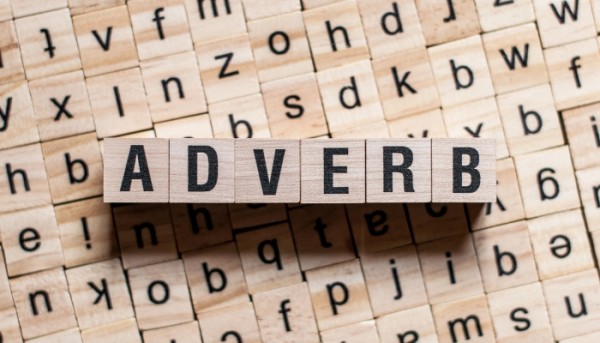 'adverb' written in scrabble letters