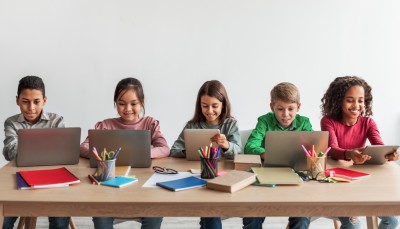 children on computers studying english