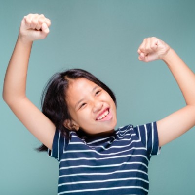 kid feeling confident after learning how to speak english