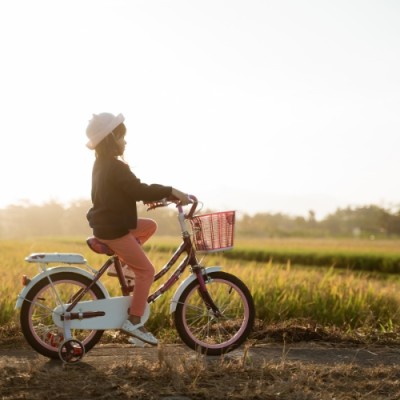 little girl developing independence on bike