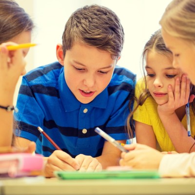 children learning and writing together